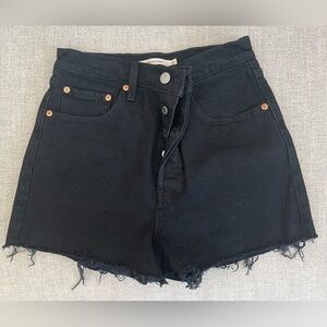 Levi’s black distressed hem shorts with button fly
